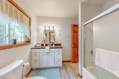 a bathroom with a sink and a toilet and a tub at Tall Pines in Woodruff