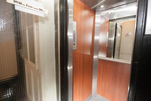 a elevator in a train with a glass door at Fashion Loft in Prague