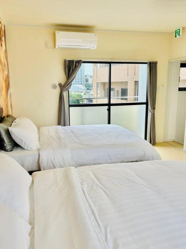 Katil atau katil-katil dalam bilik di GLOU Shinjuku Family - Urban Stay in Tokyo Shinjuku Area, Walking distance of Kabukicho