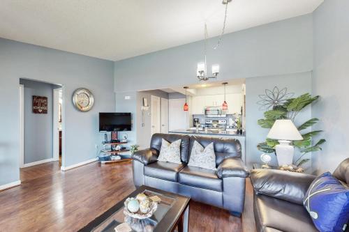 a living room with a leather couch and a table at 116 Lake Club Dr, #12 Branson MO in Branson