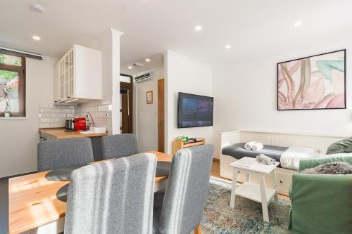 a living room with a couch and a dining room at Monbuhim Twin in Veszprém