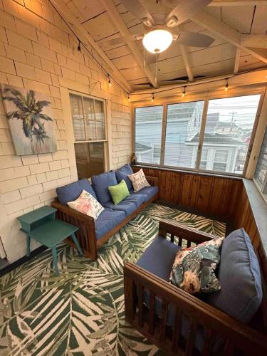 a living room with a couch and a table at The Tides At Hampton Beach in Hampton