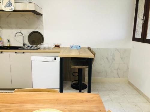 a kitchen with a counter and a sink in it at Casa Scaglione in Porticcio
