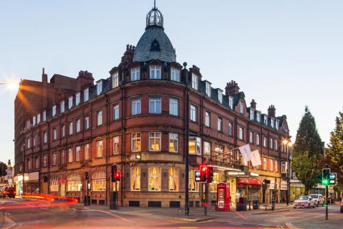 a large building on the corner of a street at Mercure Doncaster Centre Danum Hotel in Doncaster