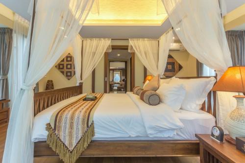 Postel nebo postele na pokoji v ubytování Ozone Villa Phuket