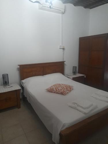 a bedroom with a bed and two night stands at Ivi's House Giolou in Paphos City