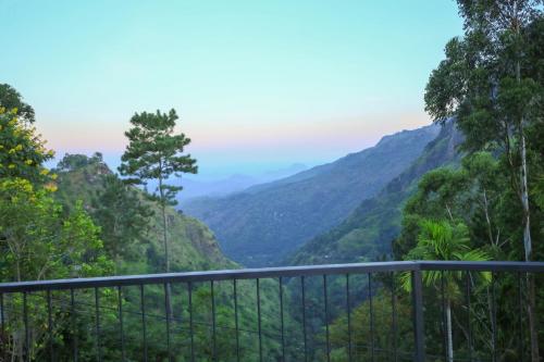 a view of the mountains from a balcony at Beyond Nomad Luxury Hostel in Ella