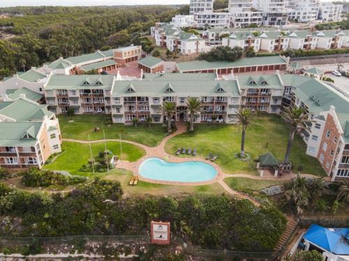 an aerial view of a resort with a swimming pool at Brookes Hill 1 Bedroom in Summerstrand
