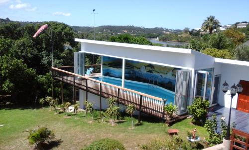 a house with a swimming pool in the backyard at Heidi Haus in Port Alfred