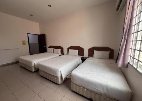 SL Villa Guesthouse, Kuantanにあるベッド
