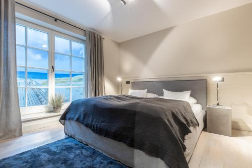 Postel nebo postele na pokoji v ubytování Sylt Pur