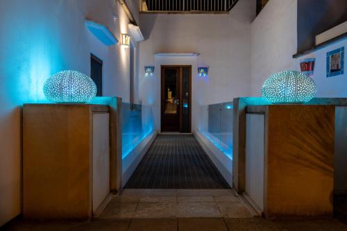 a hallway in a building with blue lights at The Crown Palace - Gallipoli in Gallipoli