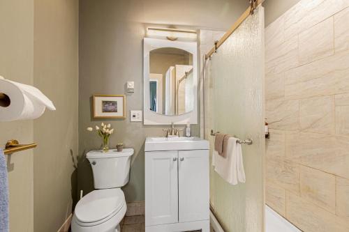 a bathroom with a toilet and a sink and a shower at Vintage 3 Bedroom Home in Prime Eastlake Seattle with Private Parking in Seattle