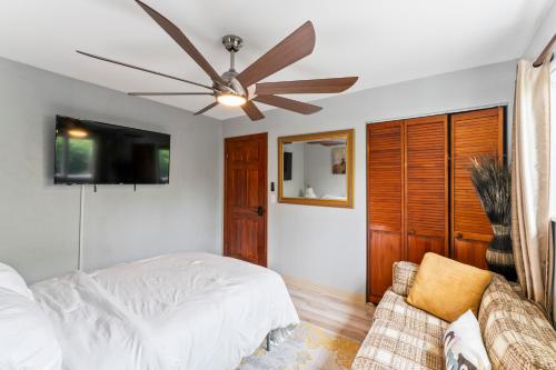 a bedroom with a bed and a ceiling fan at Stylish Studio Suite Near Downtown in Anchorage