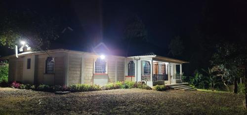 a small house with a light on top of it at Aberdare Home in Othaya