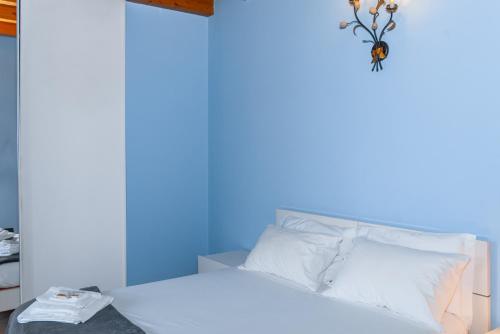 Ένα ή περισσότερα κρεβάτια σε δωμάτιο στο Casa Vacanze Renata