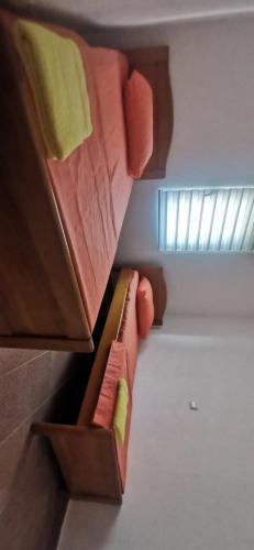 a bedroom with two bunk beds and a window at Adrovic in Bar, Susanj