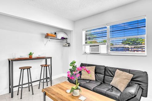 a living room with a couch and a table at New 2 Bed Studio Close To Beach & Casino Ha04 in Hollywood