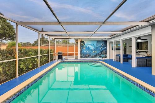 an indoor swimming pool with a pergola over it at Vacation Villa W Heated Pool Beach & Casino in Hollywood