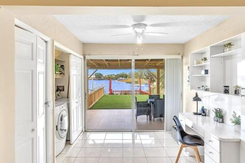 a kitchen with a door open to a yard at Beautiful Cozy Lakefront HomeCasinoAirportBeach in Fort Lauderdale