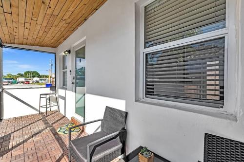 a balcony with a chair and a window at Two Bedroom Hollywood Beach Vacation Sc01 in Hollywood