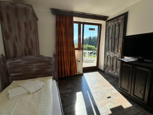 Postel nebo postele na pokoji v ubytování Haus Andrea