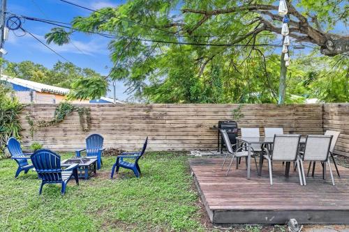 a patio with chairs and tables and a grill at Two Bedroom Hollywood Beach Vacation Sc01 in Hollywood