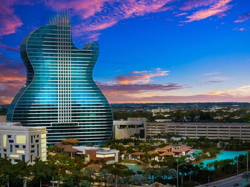 a guitar shaped building with a city in the background at Hollywood 2 Bdrm Beach Vacation & Hard Rock Sc02 in Hollywood