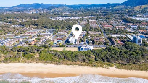 an aerial view of a city with a hot air balloon at Ocean Echoes Coffs Harbour- Short walk to the beach, Cafes and clubs! in Coffs Harbour