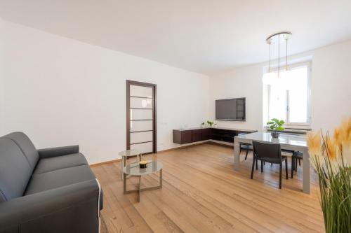 a living room with a couch and a table at Milan Royal Suites - Centro in Milan