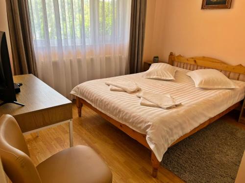 Postel nebo postele na pokoji v ubytování Casa Potcoava