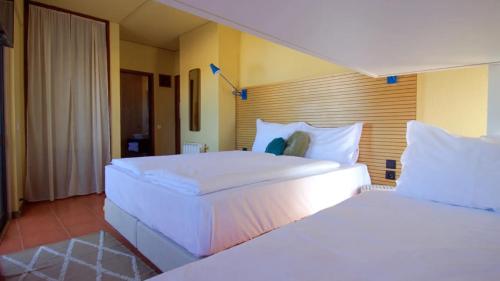 Cama ou camas em um quarto em WOT Sintra Ocean