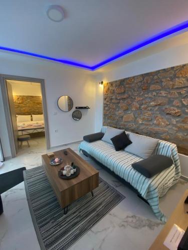 a living room with a couch and a table at Alexandra apartment in Athens
