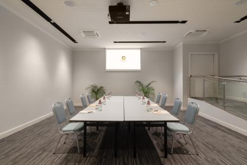 A área empresarial e/ ou a sala de conferências de Hotel Cristoforo Colombo
