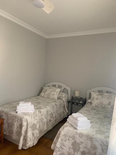 Ένα ή περισσότερα κρεβάτια σε δωμάτιο στο Casa Victoria