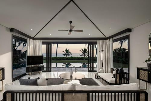 a living room with a couch and a table at TIA Wellness Resort - Spa Inclusive in Da Nang