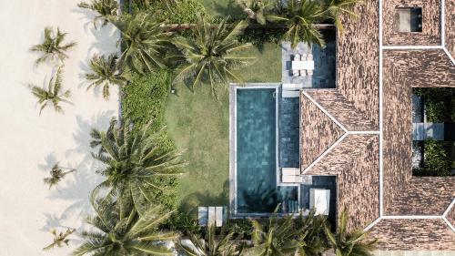 an aerial view of a villa with palm trees at TIA Wellness Resort - Spa Inclusive in Da Nang