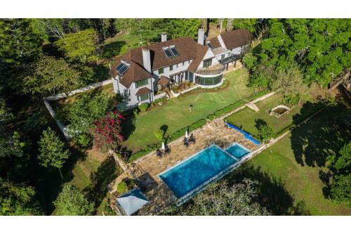 an aerial view of a house with a swimming pool at Ol Endeti House in Kuhora Twana