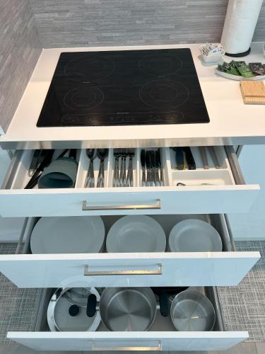 a kitchen drawer filled with pots and pans at L'incanto Home 2 in Cittadella