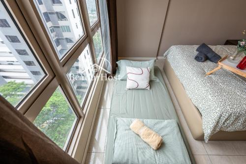 Ένα ή περισσότερα κρεβάτια σε δωμάτιο στο Dorsett Residences Sri Hartamas 5 Star Suites KL