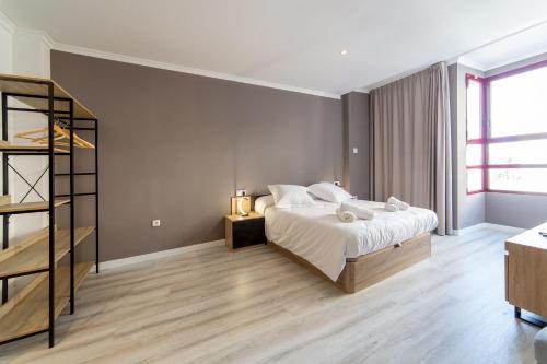 Ένα ή περισσότερα κρεβάτια σε δωμάτιο στο Albufera Dreams Nature Suites