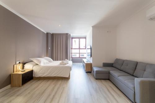 Ένα ή περισσότερα κρεβάτια σε δωμάτιο στο Albufera Dreams Nature Suites
