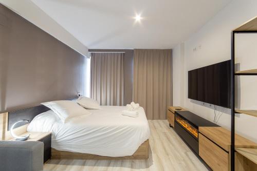 Ένα ή περισσότερα κρεβάτια σε δωμάτιο στο Albufera Dreams Nature Suites