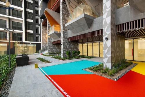 a building with a colorful carpet in front of it at Căn Hộ cao cấp The Emerald Golf View Thuận An Bình Dương in Thuan An