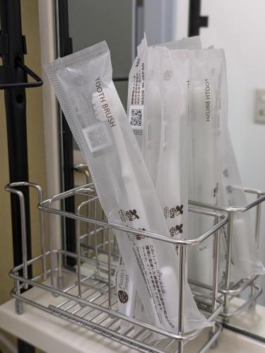a metal basket with white bags on a counter at Space Noa201 in Tokyo