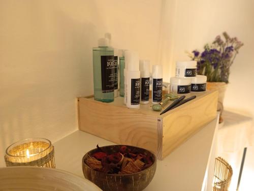 a wooden shelf with a bunch of products on it at ICON Valparaiso - Adults Only in Cala Murada
