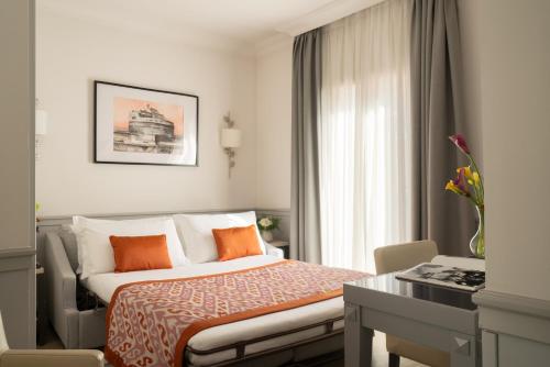 Ένα ή περισσότερα κρεβάτια σε δωμάτιο στο Hotel Della Conciliazione