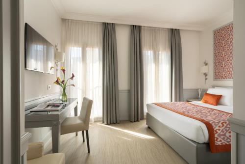 Ένα ή περισσότερα κρεβάτια σε δωμάτιο στο Hotel Della Conciliazione