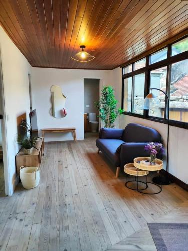 a living room with a couch and a table at Casa Rural Xures Lobios in Pereira