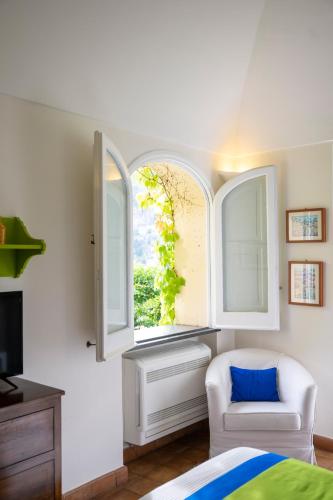 Ένα ή περισσότερα κρεβάτια σε δωμάτιο στο Casa Mercè Positano